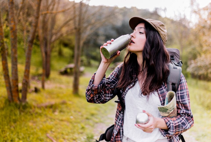  Travel Essentials - Choose sustainable options like reusable water bottles